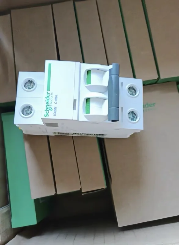An electrical component photographed with its product packaging.