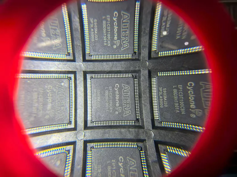 Component package markings viewed through a magnifier.